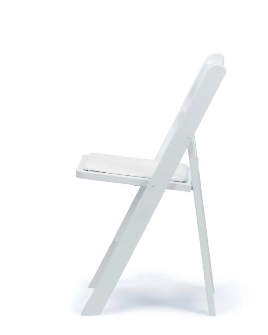 A white padded resin folding chair